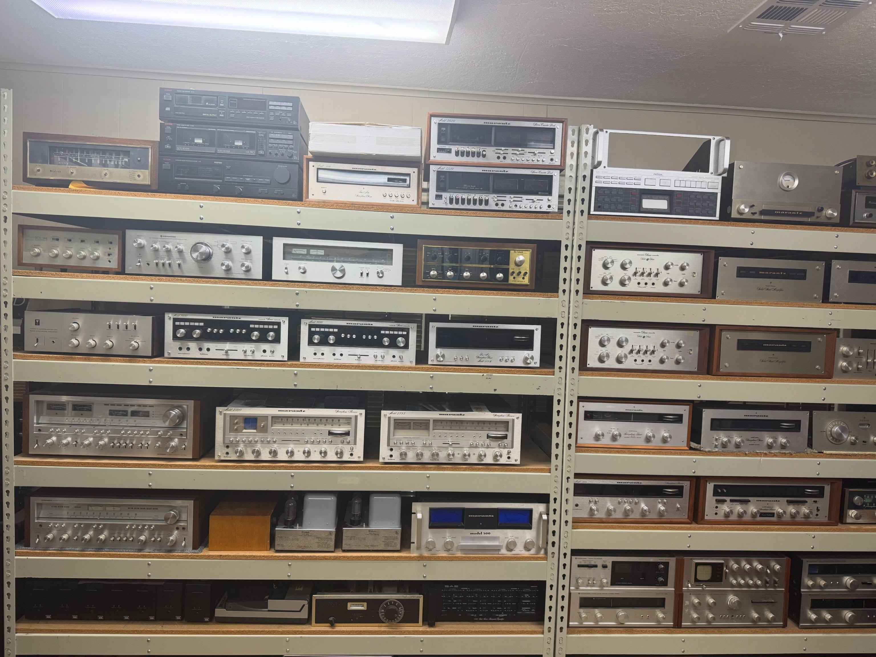 Shelves of vintage receivers and amplifiers inside Speakerworks